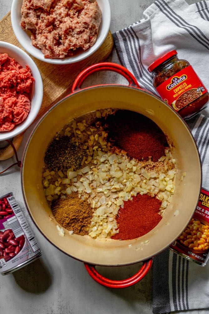 onion and garlic in a pot with spices
