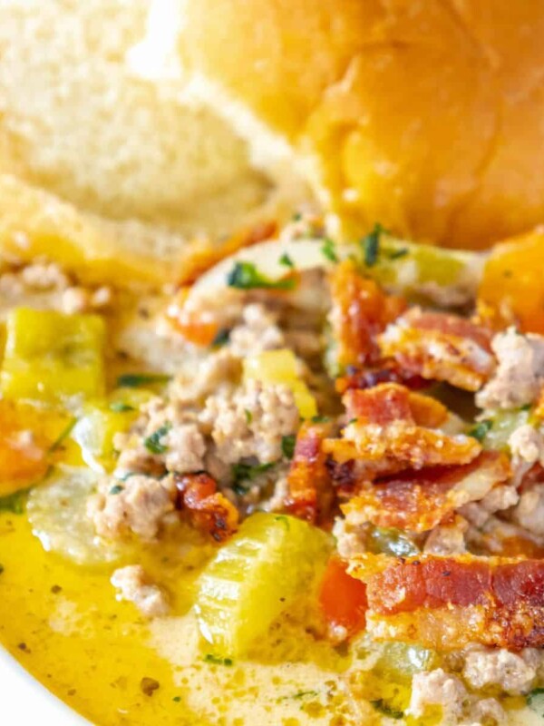 A bowl of chicken noodle soup with bacon and vegetables, easy cheeseburger soup recipe.