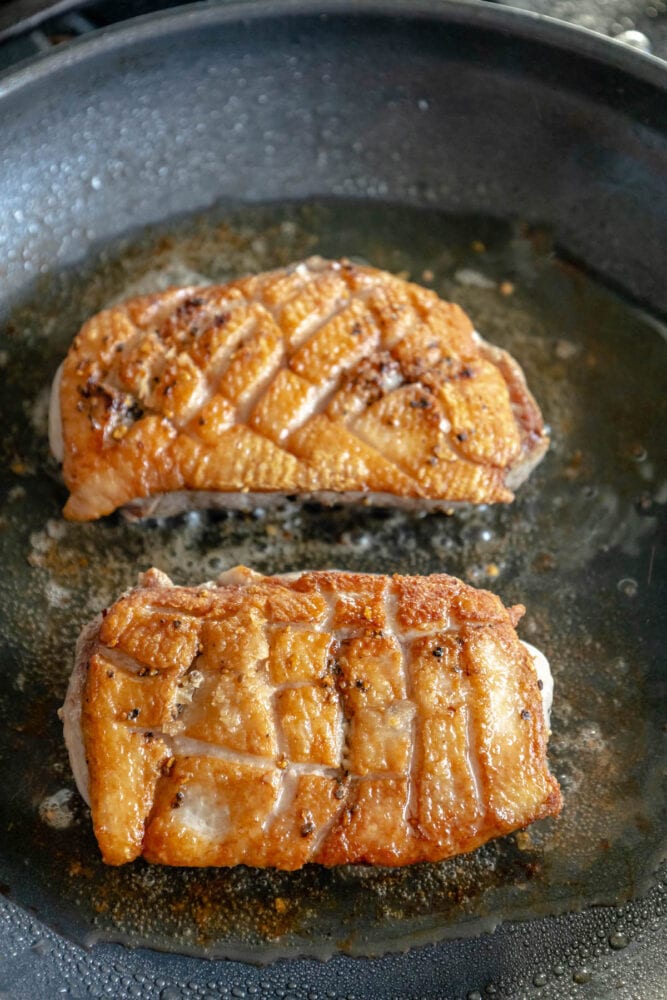 duck searing in a pan 