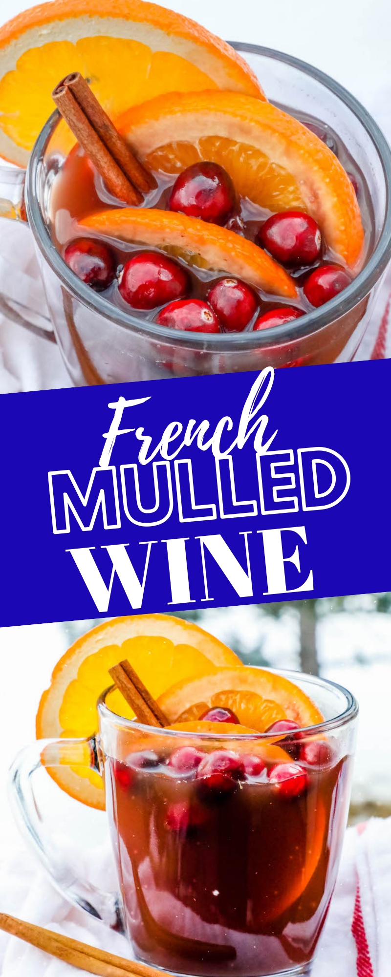 cider in a clear mug with slices of orange and cranberries with cinnamon sticks