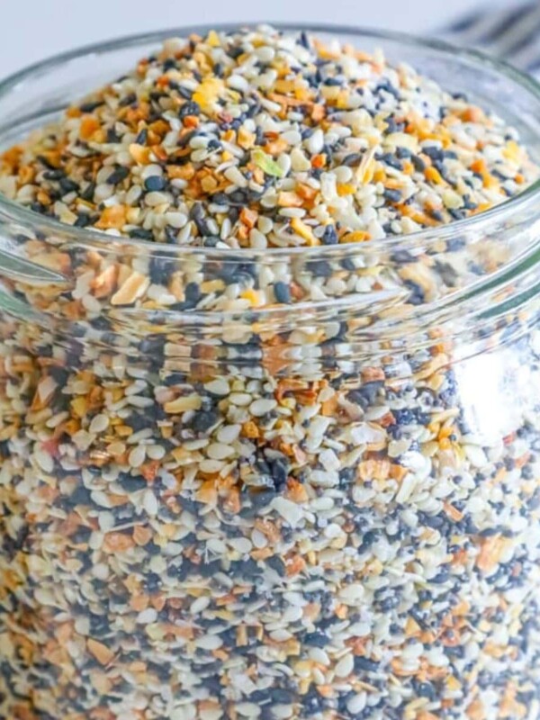 A jar of The Best Everything Bagel Seasoning Mix Recipe on a table.