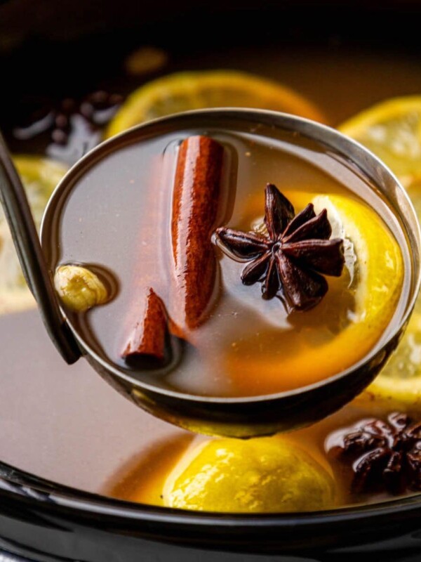 a ladle with cider in it