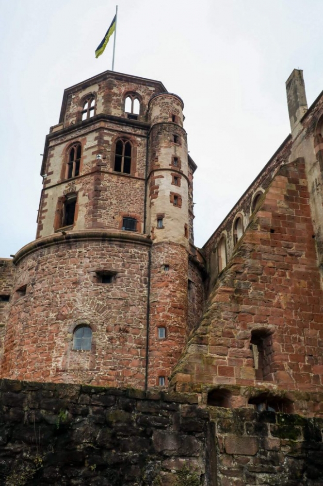 A clock tower amidst the grandeur of Heidelberg Castle.